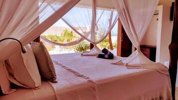 Quarto triplo standard, vista para o jardim | Vista para o jardim