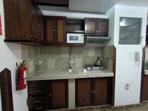 Family Triple Room, Courtyard View | Private kitchen | Microwave