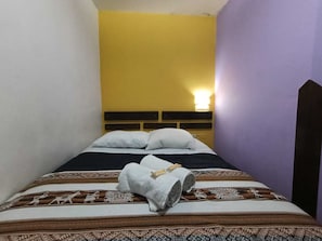 Economy Triple Room, Courtyard View | Laptop workspace, blackout drapes, iron/ironing board, free WiFi