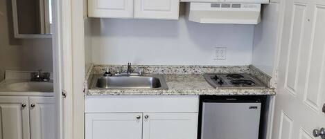 Fridge, microwave, stovetop, cookware/dishes/utensils