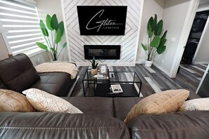 Smart TV, fireplace, books