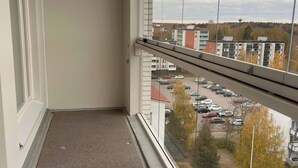 A balcony with a view of a parking lot and buildings. - Helsinki City or Airport 16min, Convenience Place (Vantaa)