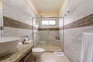 Shower, hair dryer, towels, shampoo