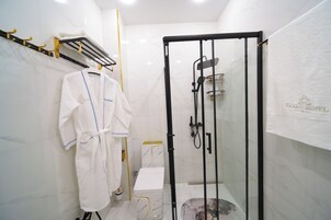 Shower, hair dryer, towels, soap