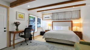 A bedroom with a bed, desk, chair, and a window with curtains. - Overlook Hotel (Saugerties)