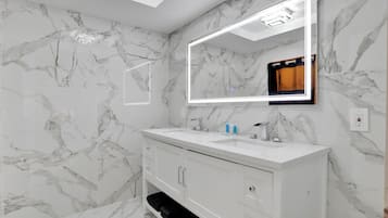 Quadruple Room, 2 Queen Beds | Bathroom | Shower, hair dryer, soap, shampoo