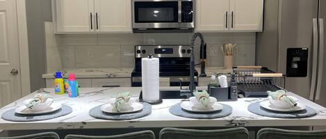 Coffee/tea maker, fridge, microwave, oven