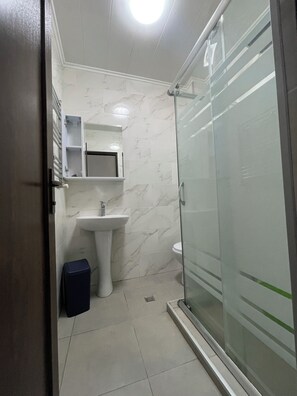Shower, hair dryer, towels, soap