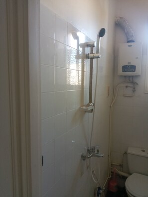 Shower, towels, soap, toilet paper