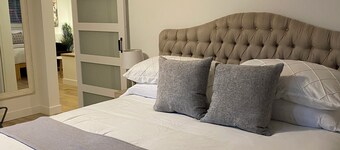 A spacious private lower level escape near lakes, trails and ocean views.