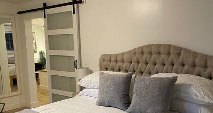 A spacious private lower level escape near lakes, trails and ocean views.