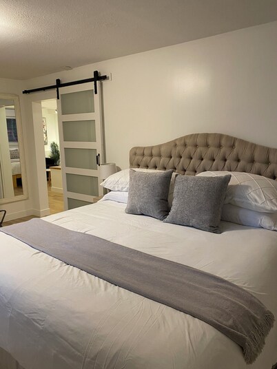 A spacious private lower level escape near lakes, trails and ocean views.