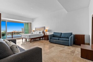 Romantic Apartment | Living area | 65-inch Smart TV with cable channels, offices - Deck12 Casino and Resort by Monyxbnb (Puerto Vallarta)