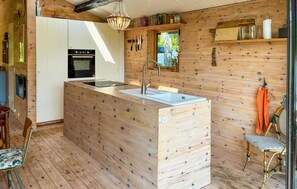 Fridge, stovetop, dishwasher, coffee/tea maker