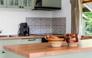 Fridge, stovetop, dishwasher, coffee/tea maker