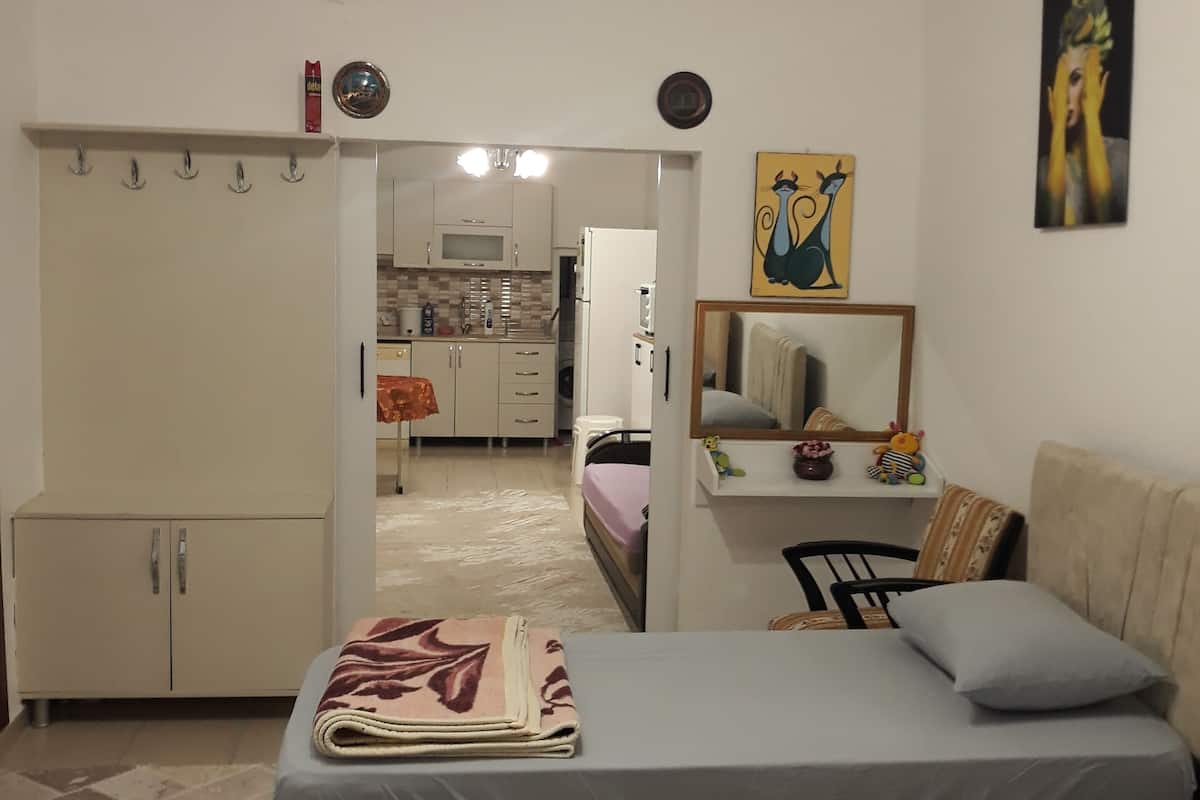 Comfort Quadruple Room, Multiple Beds, Patio, Garden View | Laptop workspace, iron/ironing board