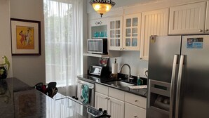Coffee/tea maker, fridge, microwave, oven - Charming Urban Oasis with Balcony in Savannah! (Savannah)