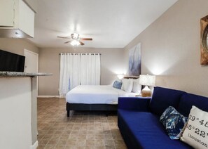 Desk, iron/ironing board, travel crib, bed sheets