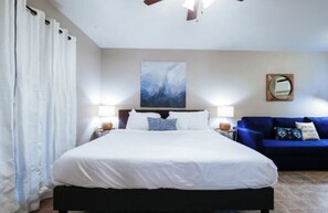 Desk, iron/ironing board, travel crib, bed sheets