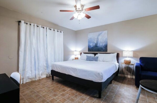 Desk, iron/ironing board, travel crib, bed sheets