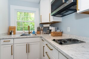 Fridge, microwave, stovetop, coffee/tea maker