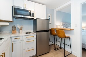 Fridge, microwave, stovetop, coffee/tea maker