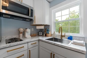 Fridge, microwave, stovetop, coffee/tea maker