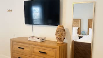 1 bedroom, desk, iron/ironing board, travel crib