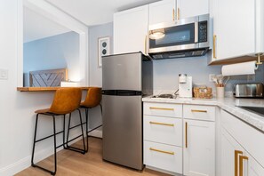 Fridge, microwave, stovetop, coffee/tea maker