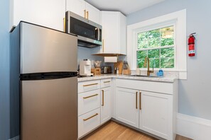 Fridge, microwave, stovetop, coffee/tea maker