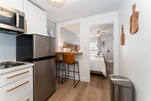 Fridge, microwave, stovetop, coffee/tea maker