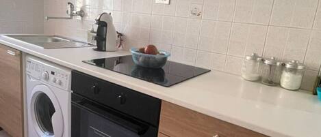 Fridge, oven, cookware/dishes/utensils