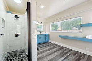 Shower, hair dryer, towels, toilet paper