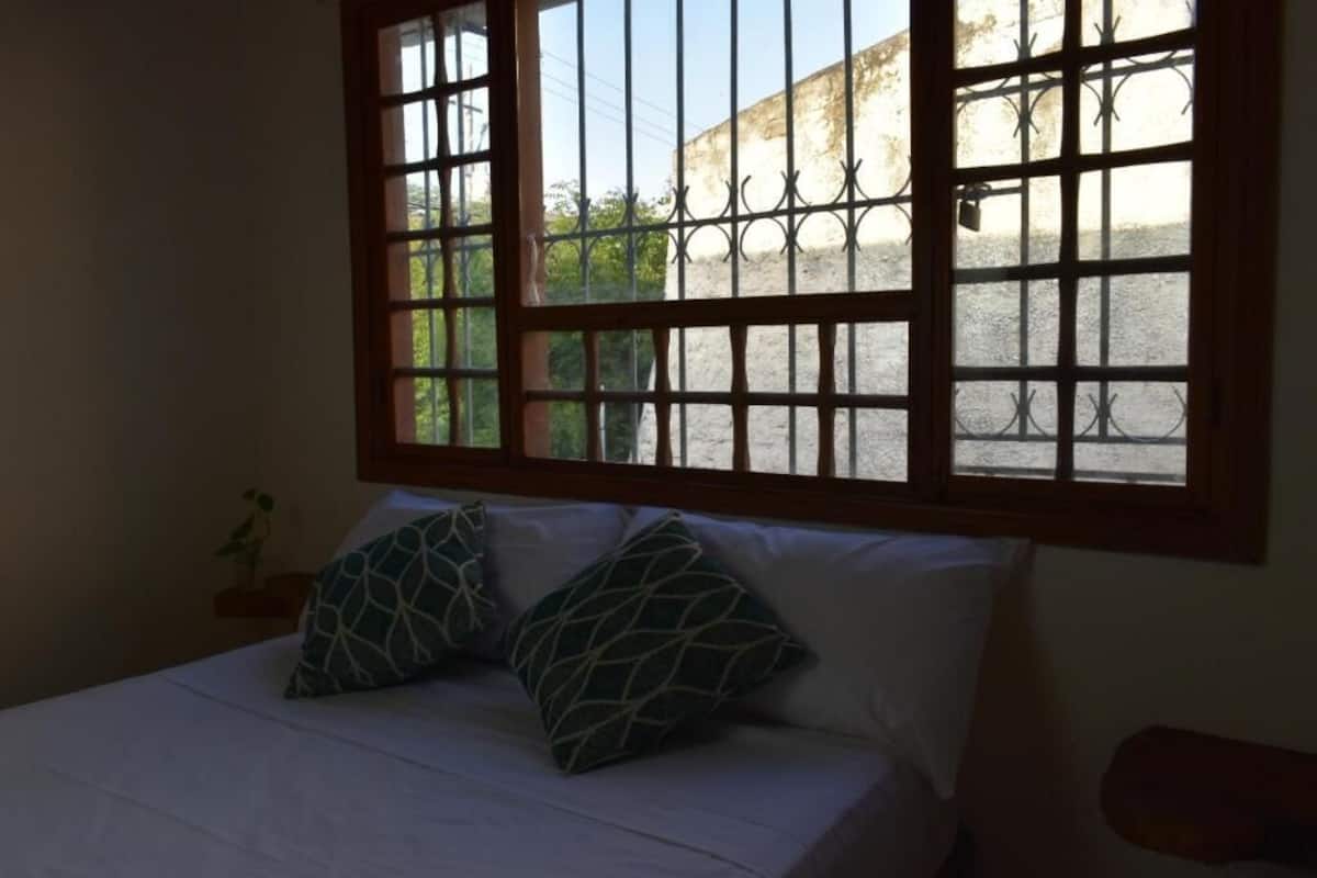Premium bedding, down duvets, blackout curtains, iron/ironing board