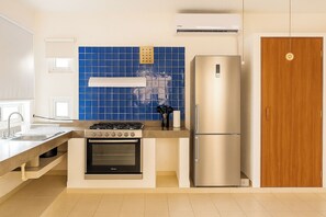 Fridge, microwave, stovetop, coffee/tea maker