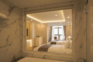 LaChateau Deluxe Twin | Bathroom | Free toiletries, hair dryer, slippers, towels