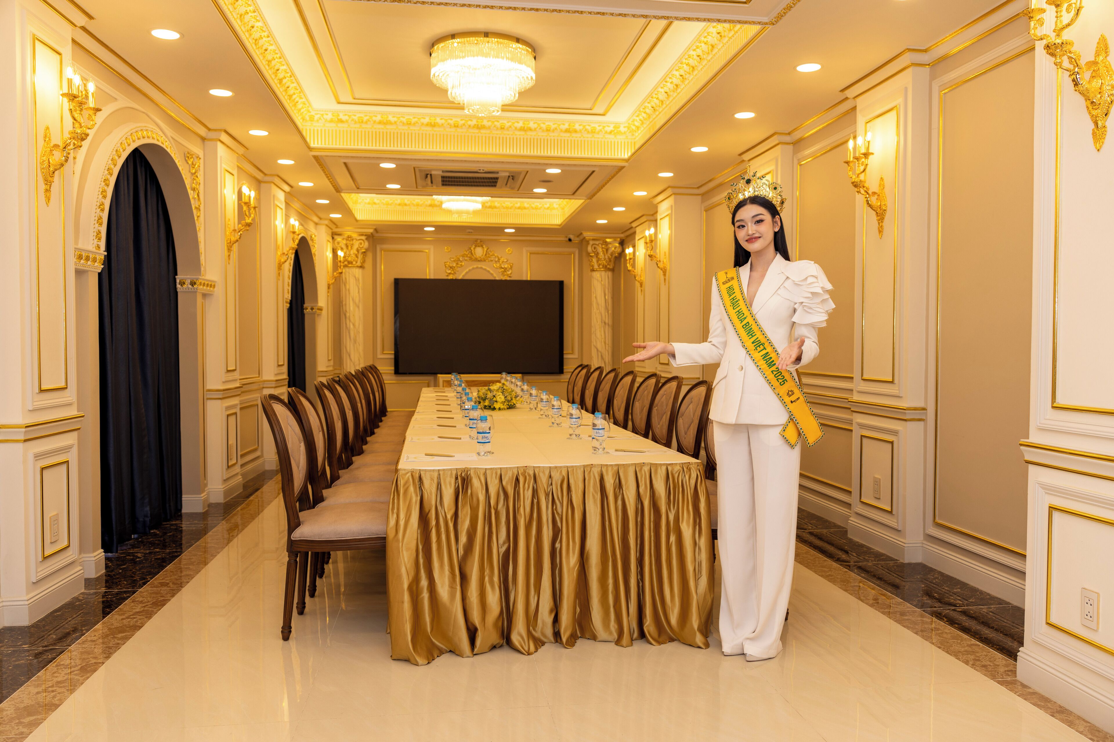 A conference room with a long table, chairs, and a podium.