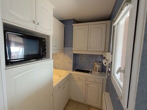 Fridge, microwave, cookware/dishes/utensils