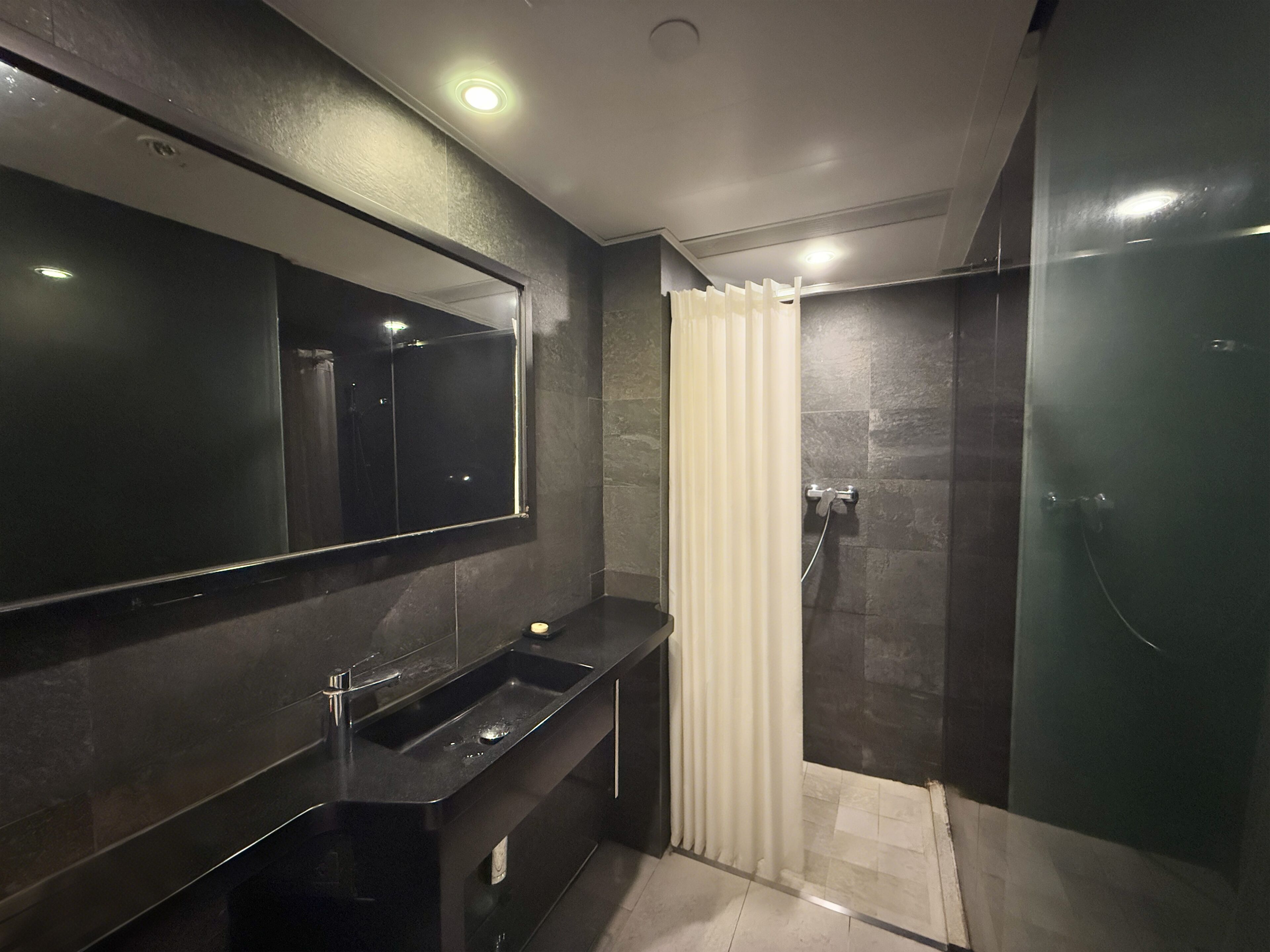 Classic Twin Room, City View | Bathroom | Shower, hair dryer, slippers, soap