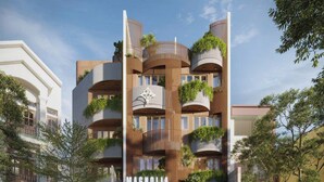 A modern hotel with multiple balconies, a prominent entrance, and a clear view of the street. - Magnolia Boutique Hue (Hue)