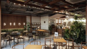 A cozy cafe with wooden furniture, a coffee bar, and a menu board. - Magnolia Boutique Hue (Hue)