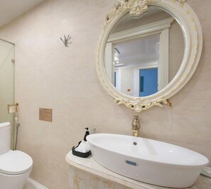 Shower, hair dryer, slippers, towels