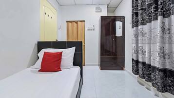 Habitación individual Deluxe | Escritorio, wifi gratis y ropa de cama