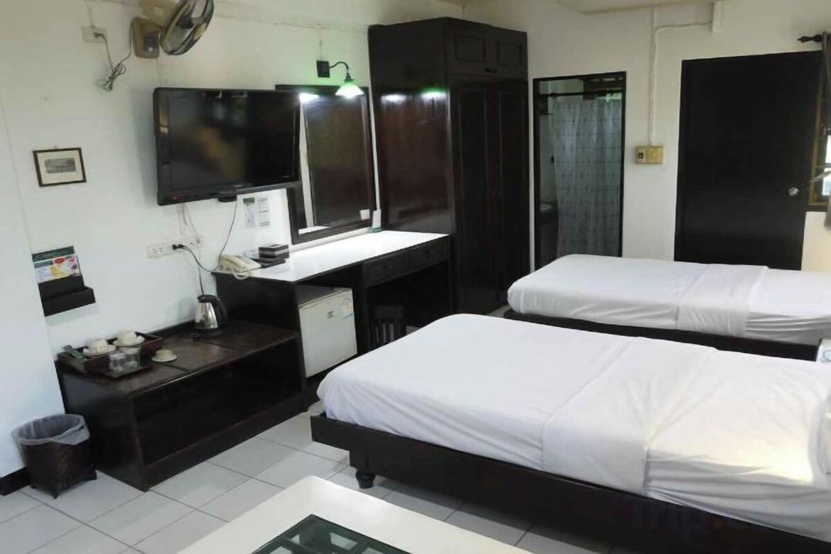 Desk, blackout drapes, rollaway beds (surcharge), WiFi (free)
