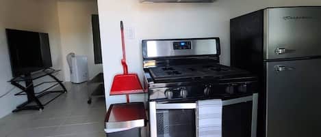 Fridge, oven, stovetop, dining tables