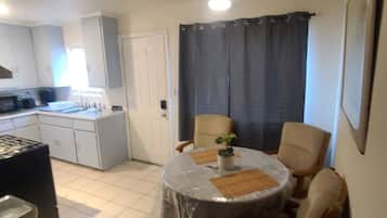 Fridge, oven, stovetop, dining tables