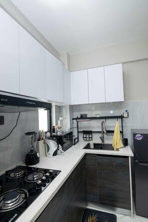 Appartement Confort, vue partielle sur la mer | Cuisine privée