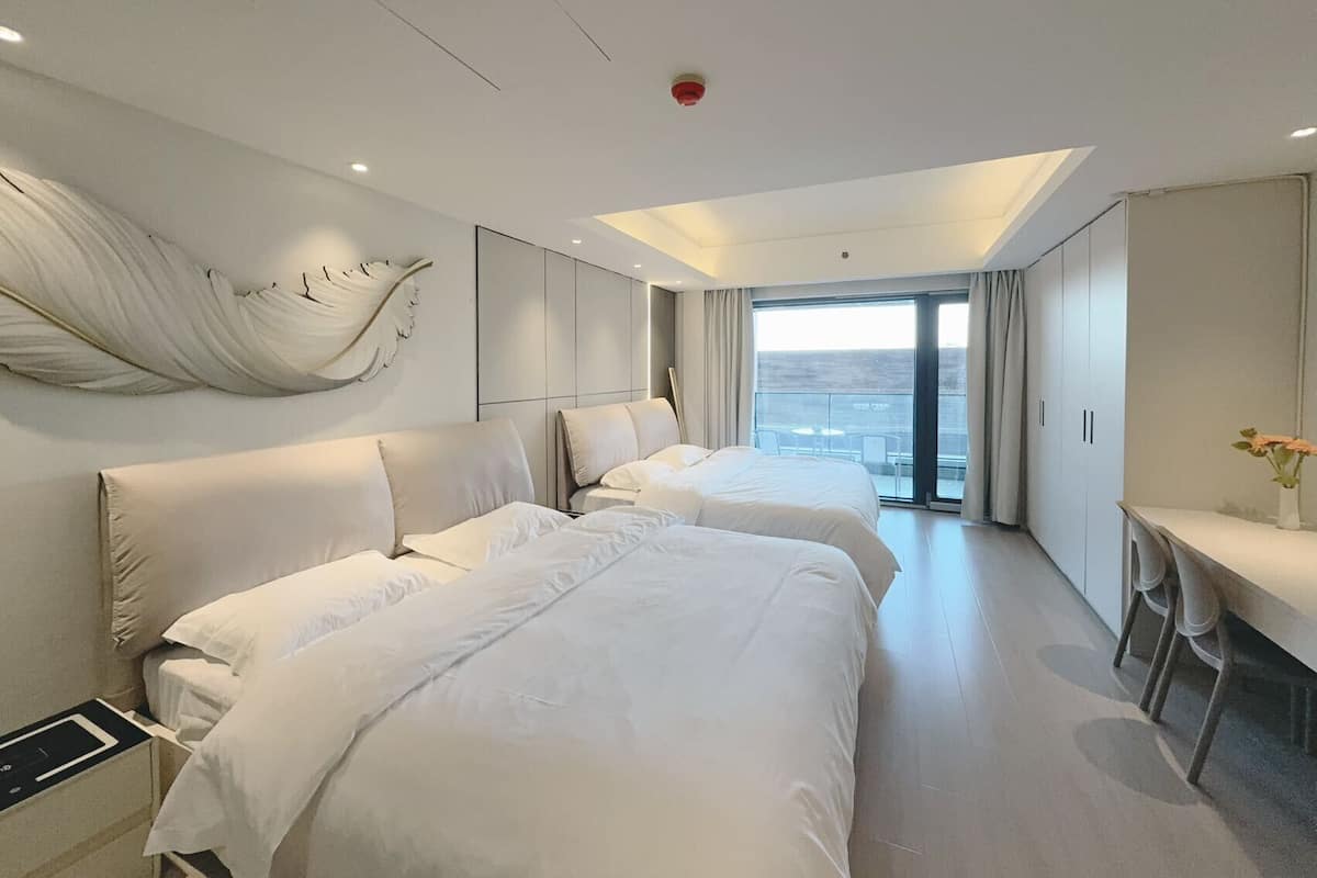 Classic Twin Room, 2 Queen Beds, Patio, City View | Free WiFi, bed sheets