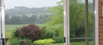 Above the Mist Dexters. Spacious comfortable home on 12 acres.