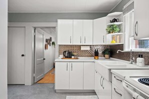 Fridge, microwave, oven, stovetop - The Canary 2BR Gem in Downtown Drumheller (Drumheller)